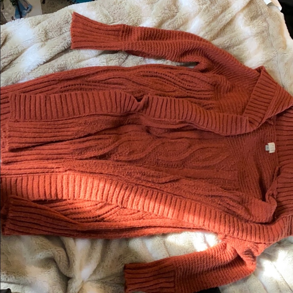 Long knitted sweater